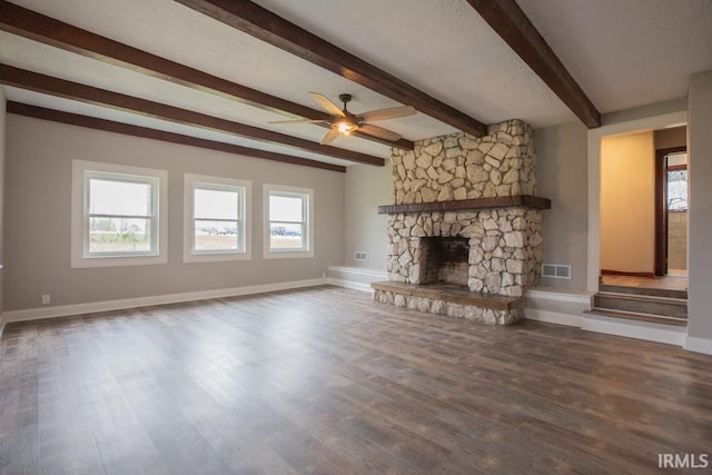 6318 Peacock Ln, Evansville, IN 47715 - unfurnished living room with a ceiling fan, beamed ceiling, wood finished floors, and baseboards