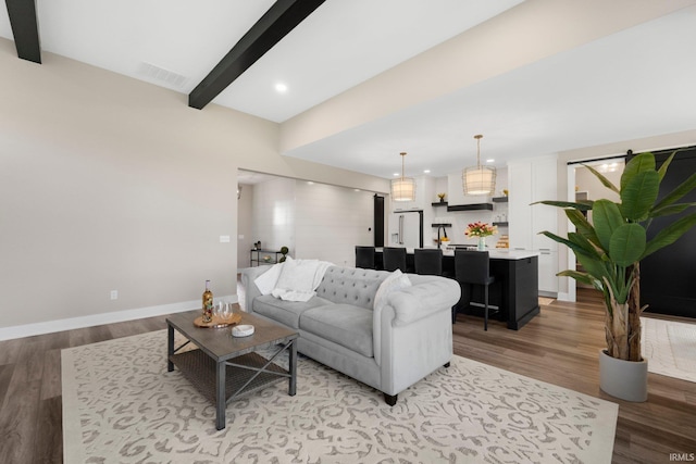 874 Cascata Trl, Huntertown, IN 46748 - living room featuring beam ceiling, light wood-type flooring, and baseboards