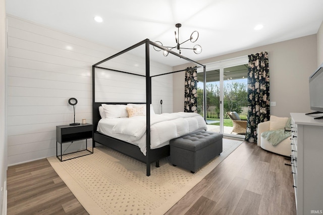 874 Cascata Trl, Huntertown, IN 46748 - bedroom with access to outside, wood finished floors, a chandelier, and recessed lighting