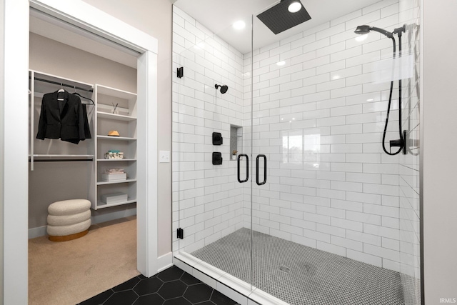 874 Cascata Trl, Huntertown, IN 46748 - bathroom featuring a stall shower, a spacious closet, tile patterned flooring, and recessed lighting