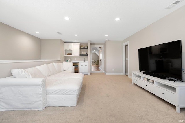 874 Cascata Trl, Huntertown, IN 46748 - living area with wet bar, light carpet, recessed lighting, wine cooler, and baseboards