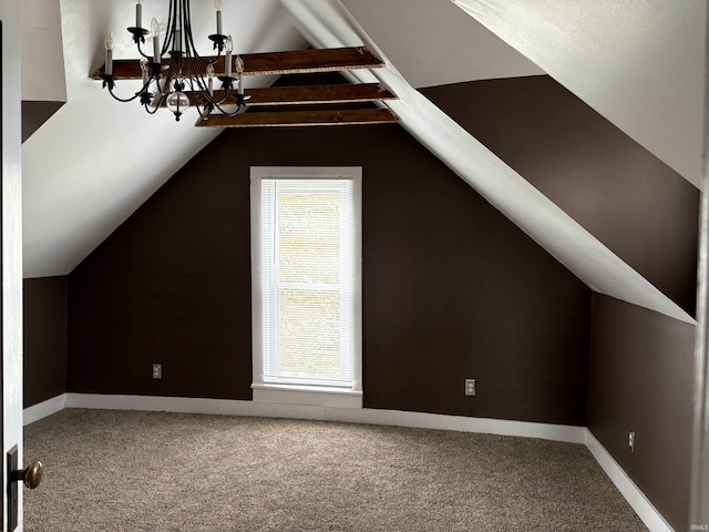 bonus room with a chandelier, carpet floors, and baseboards