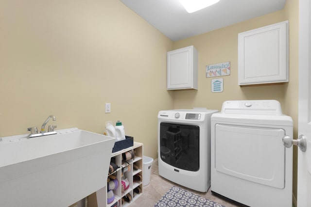 3090 Kellygreen Dr, Angola, IN 46703 - washroom featuring cabinet space, washer and dryer, and light tile patterned floors