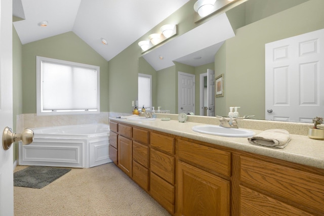 3090 Kellygreen Dr, Angola, IN 46703 - bathroom featuring vaulted ceiling, a garden tub, and double vanity