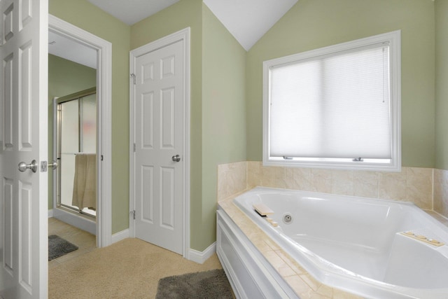 3090 Kellygreen Dr, Angola, IN 46703 - bathroom featuring a stall shower, a whirlpool tub, vaulted ceiling, and baseboards