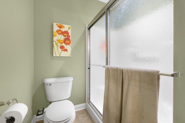 3090 Kellygreen Dr, Angola, IN 46703 - full bath featuring a shower stall, toilet, baseboards, and tile patterned floors