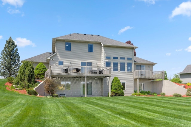 3090 Kellygreen Dr, Angola, IN 46703 - rear view of property featuring a lawn and a wooden deck