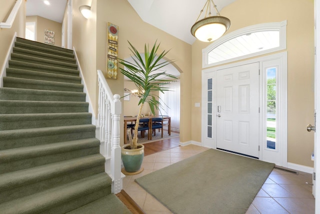 3090 Kellygreen Dr, Angola, IN 46703 - foyer featuring tile patterned floors, stairs, baseboards, and a towering ceiling