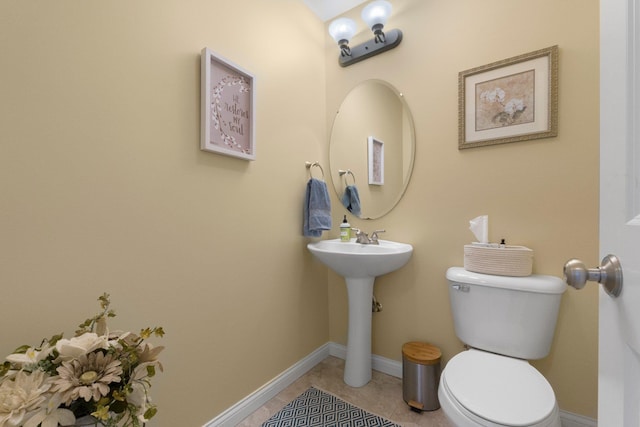 3090 Kellygreen Dr, Angola, IN 46703 - half bath with toilet, baseboards, tile patterned floors, and a sink