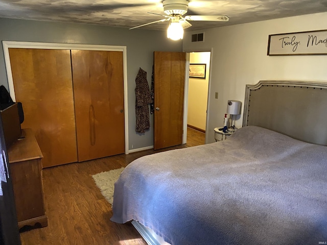 4227 S 0th Rd, Berne, IN 46711 - bedroom featuring wood finished floors, a closet, a ceiling fan, and baseboards