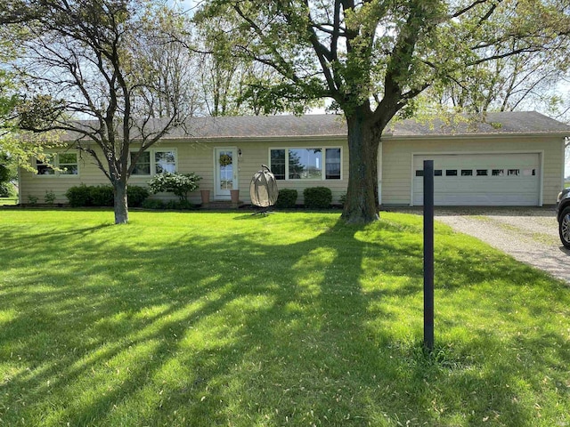4227 S 0th Rd, Berne, IN 46711 - ranch-style home with driveway, a front yard, and a garage