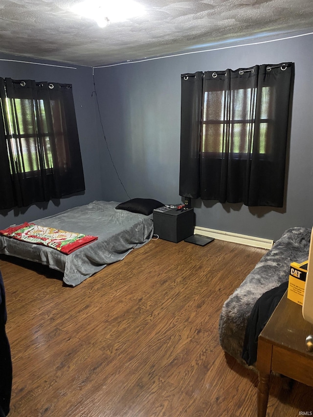 4227 S 0th Rd, Berne, IN 46711 - bedroom with a textured ceiling, wood finished floors, and baseboards