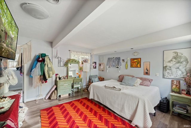 bedroom featuring wood finished floors