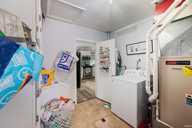 laundry room with washer / clothes dryer and attic access