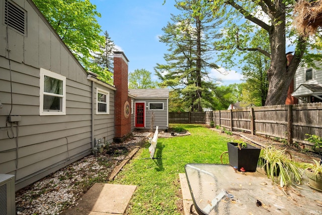 view of yard with a patio and central AC