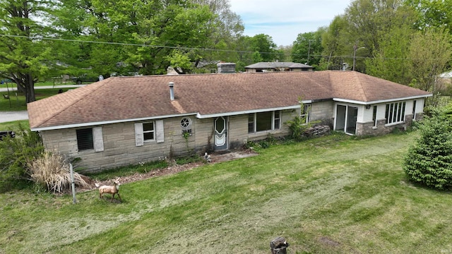 3927 E Driftwood Loop, Monticello, IN 47960 - rear view of property with a lawn and stone siding
