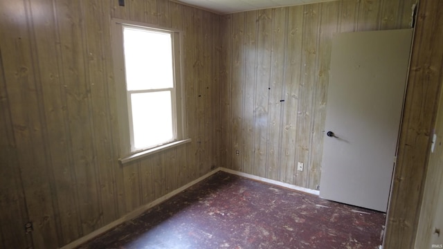 3927 E Driftwood Loop, Monticello, IN 47960 - empty room featuring wood walls and baseboards
