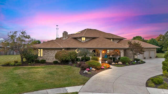 15 Saint Emily Dr, Huntington, IN 46750 - view of front facade with a chimney, a front lawn, concrete driveway, and a garage