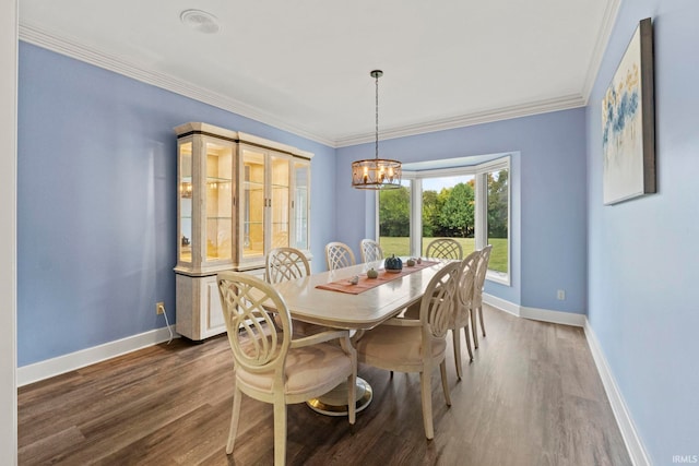 15 Saint Emily Dr, Huntington, IN 46750 - dining space featuring dark wood-style flooring, a chandelier, baseboards, and ornamental molding