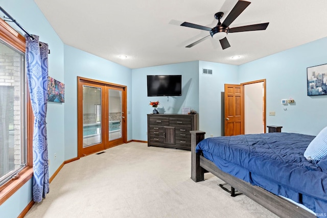 15 Saint Emily Dr, Huntington, IN 46750 - bedroom with light colored carpet, access to exterior, french doors, baseboards, and ceiling fan