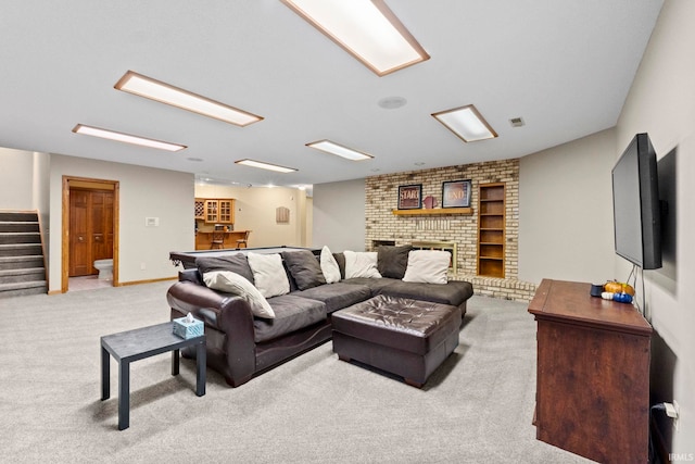 15 Saint Emily Dr, Huntington, IN 46750 - carpeted living area featuring stairway, a fireplace, and bar