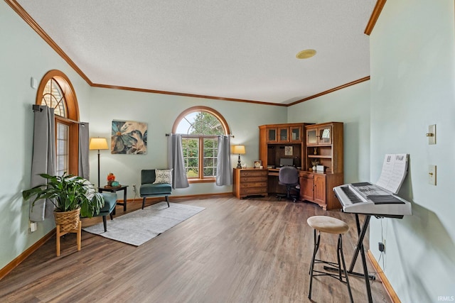 15 Saint Emily Dr, Huntington, IN 46750 - office area with wood finished floors, crown molding, baseboards, and a textured ceiling