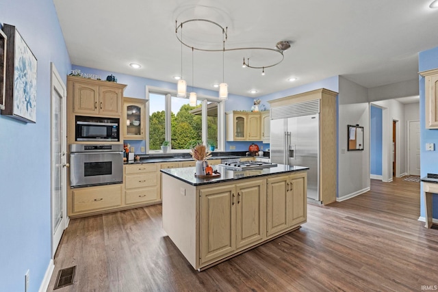 15 Saint Emily Dr, Huntington, IN 46750 - kitchen with built in appliances, baseboards, glass insert cabinets, dark countertops, and recessed lighting