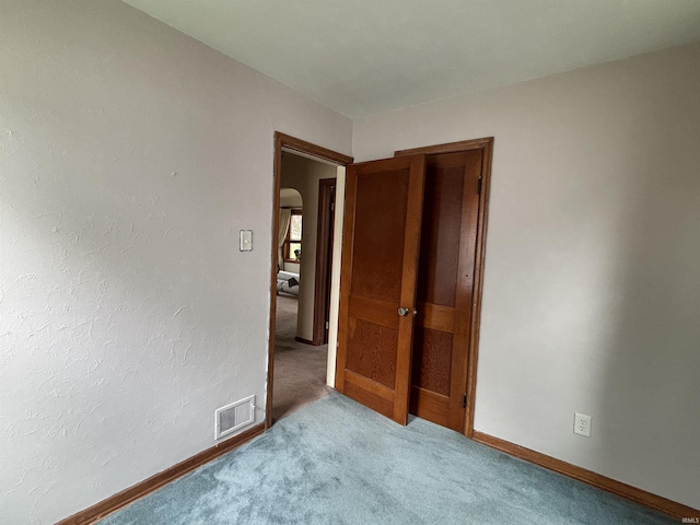 919 Kensington Blvd, Fort Wayne, IN 46805 - carpeted spare room featuring baseboards and arched walkways