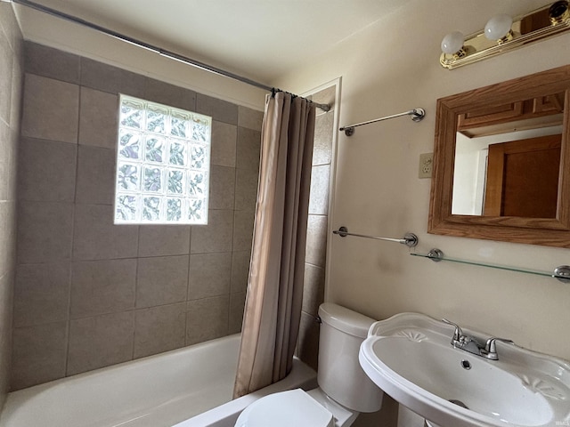 919 Kensington Blvd, Fort Wayne, IN 46805 - full bathroom with a sink, shower / bathtub combination with curtain, and toilet