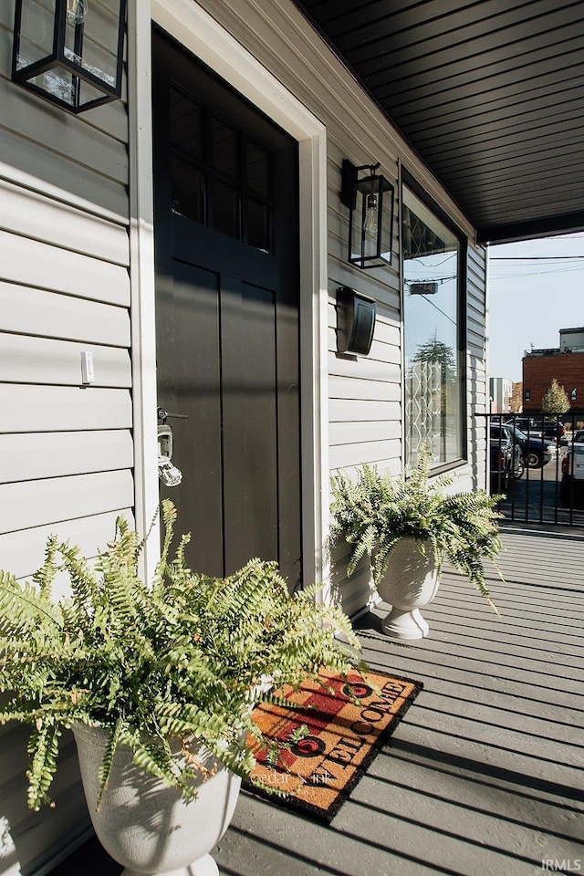 property entrance with covered porch