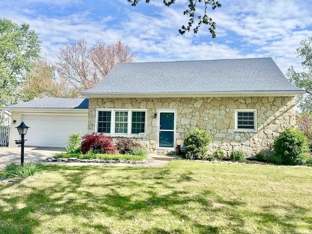 6701 Bellefield Dr, Fort Wayne, IN 46835 - view of front of home with stone siding, a garage, a front lawn, driveway, and roof with shingles