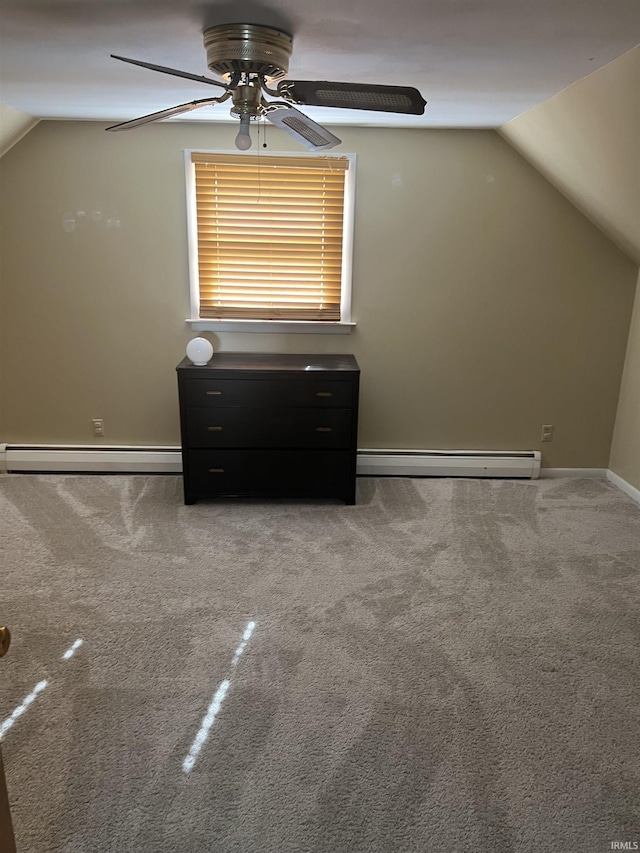 6701 Bellefield Dr, Fort Wayne, IN 46835 - unfurnished bedroom featuring baseboard heating, a baseboard radiator, vaulted ceiling, carpet, and baseboards