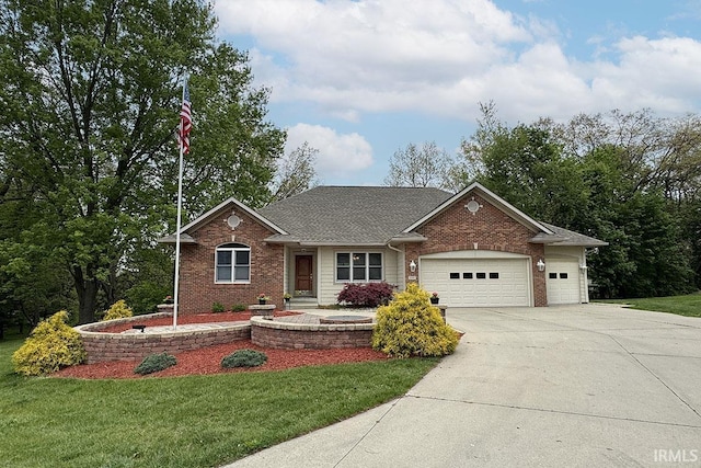 view of front of home with a garage, driveway, a front lawn, and brick siding
