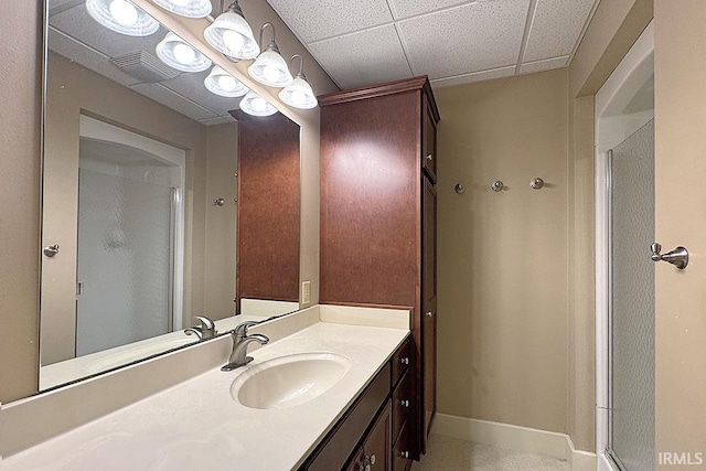 bathroom with a shower stall and vanity