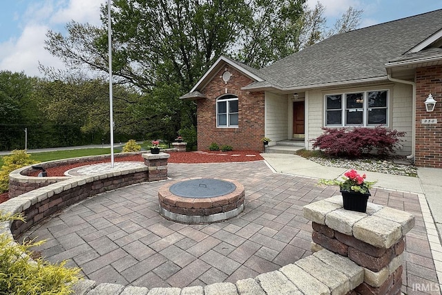 view of patio featuring an outdoor fire pit
