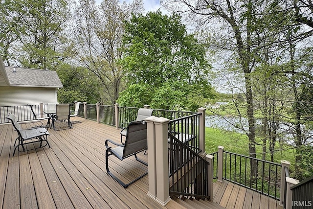wooden deck featuring outdoor dining area and stairs