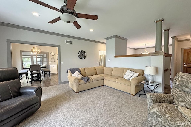 carpeted living room with ornamental molding, ceiling fan, recessed lighting, baseboards, and wood finished floors