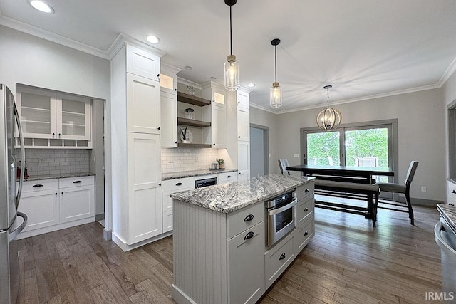 kitchen featuring stainless steel appliances, open shelves, white cabinetry, light stone counters, and backsplash