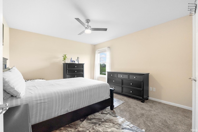 bedroom with carpet, ceiling fan, and baseboards