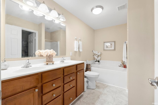 bathroom with double vanity, a bath, a stall shower, and toilet