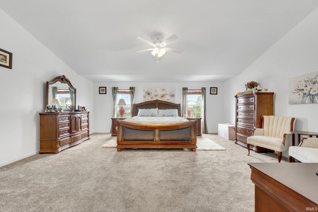 bedroom featuring light carpet and a ceiling fan
