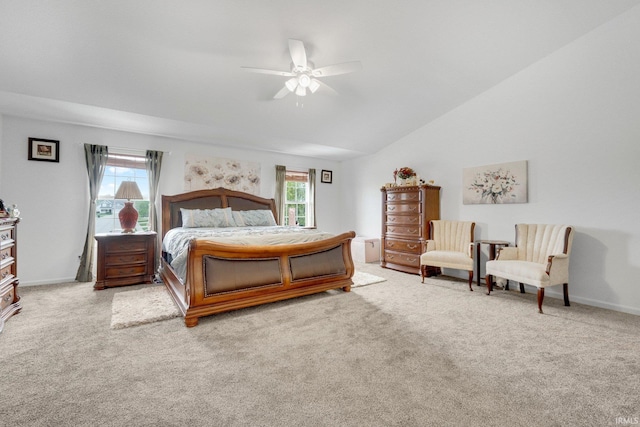 carpeted bedroom with vaulted ceiling, a ceiling fan, and baseboards