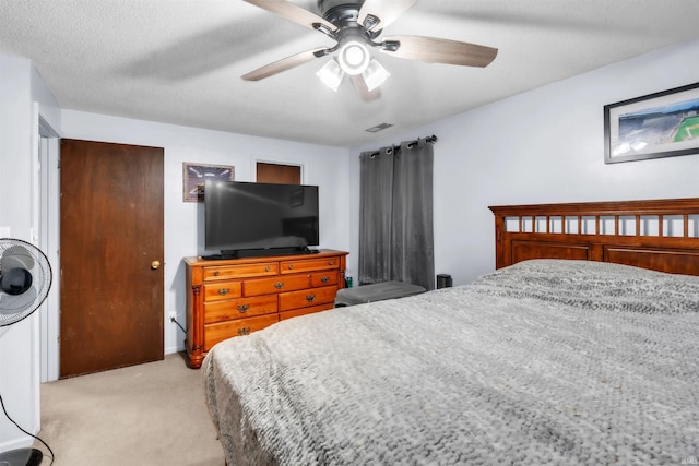 bedroom featuring light carpet and ceiling fan
