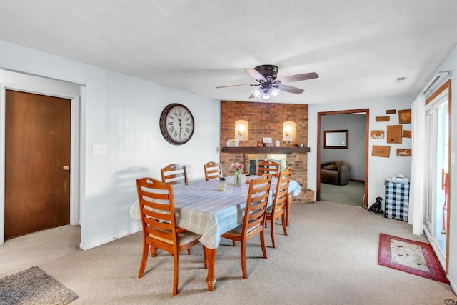 dining area featuring carpet flooring and a ceiling fan