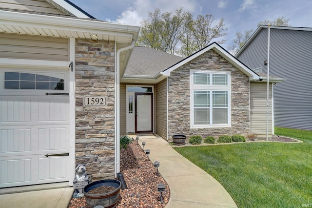 1592 Breckenridge Pass, Fort Wayne, IN 46845 - entrance to property featuring stone siding, a yard, and a shingled roof