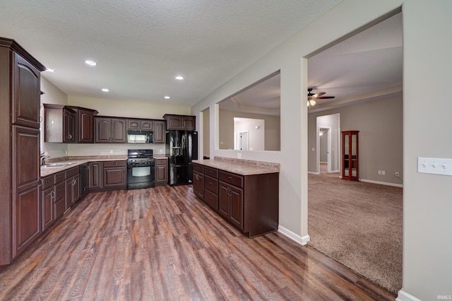 1592 Breckenridge Pass, Fort Wayne, IN 46845 - kitchen with black appliances, dark brown cabinets, light countertops, a sink, and recessed lighting