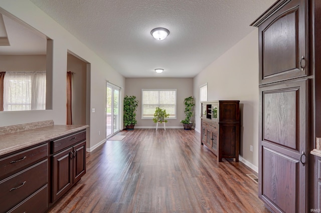 1592 Breckenridge Pass, Fort Wayne, IN 46845 - entryway featuring wood finished floors, baseboards, and a textured ceiling