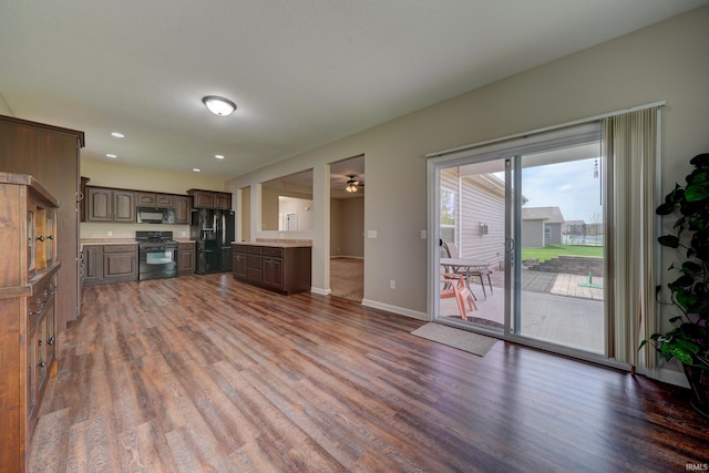 1592 Breckenridge Pass, Fort Wayne, IN 46845 - kitchen featuring black appliances, dark wood-style flooring, dark brown cabinets, light countertops, and recessed lighting