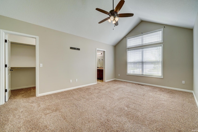 1592 Breckenridge Pass, Fort Wayne, IN 46845 - unfurnished bedroom with carpet flooring, vaulted ceiling, a spacious closet, and baseboards