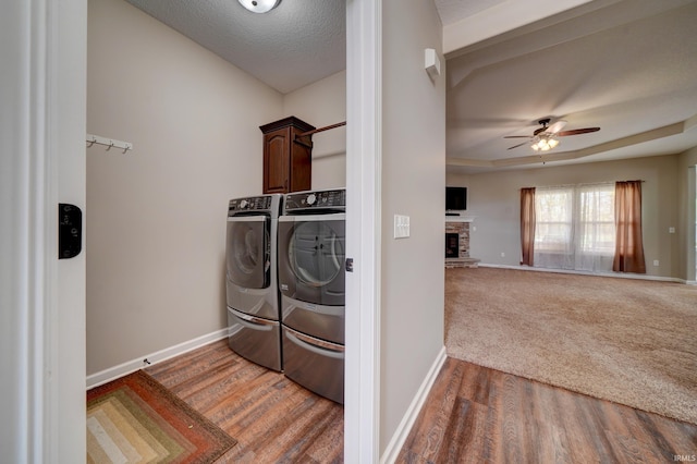 1592 Breckenridge Pass, Fort Wayne, IN 46845 - laundry room featuring cabinet space, separate washer and dryer, a ceiling fan, baseboards, and a textured ceiling